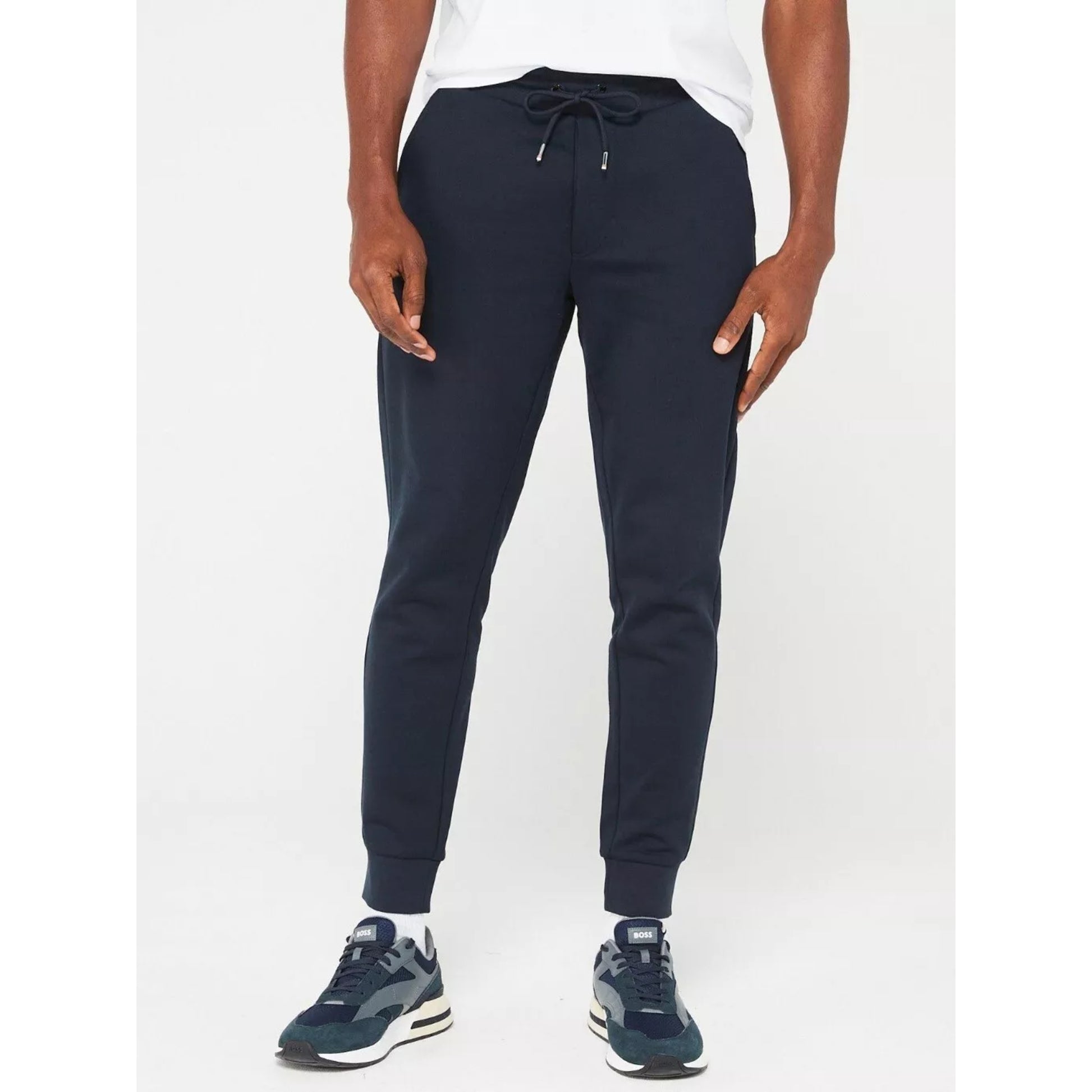 Men's navy blue slim fit jogging bottoms with drawstring waist and cuffed ankles