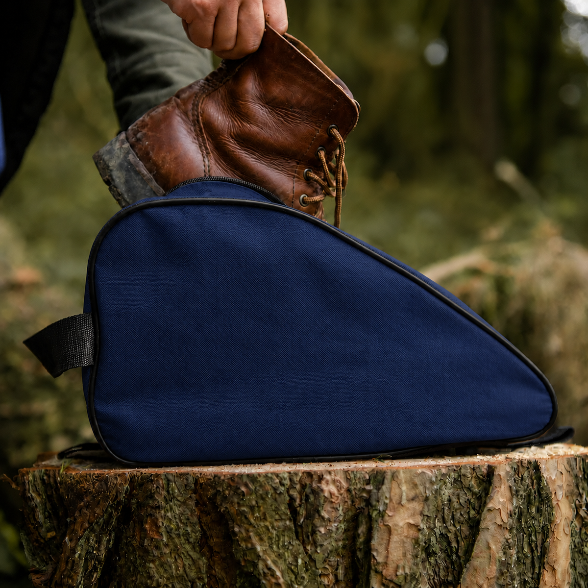 Navy waterproof boot bag with a curved zip opening and durable fabric finish