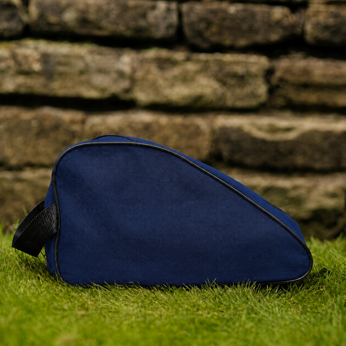 Navy waterproof boot bag with a curved zip opening and durable fabric finish