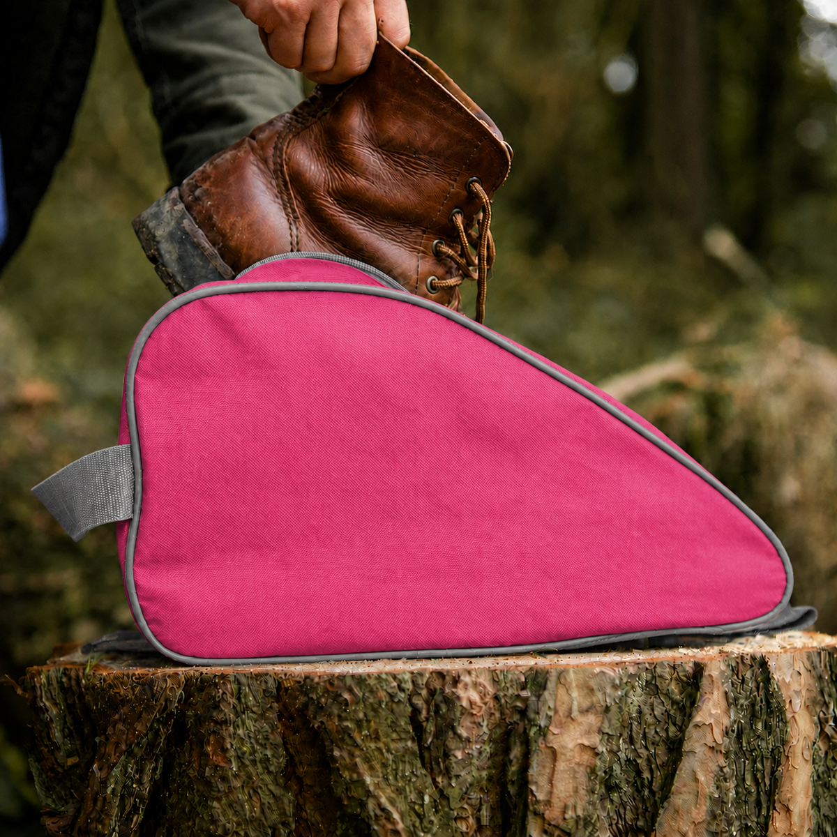 Pink waterproof boot bag with a curved zip opening and durable fabric finish.