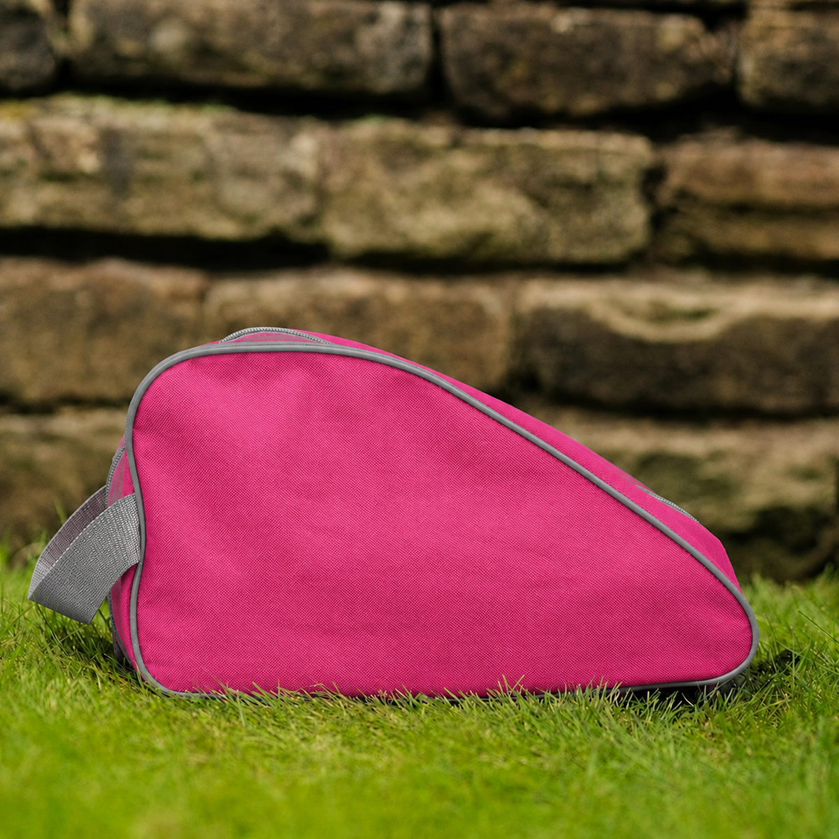 Pink waterproof boot bag with a curved zip opening and durable fabric finish.