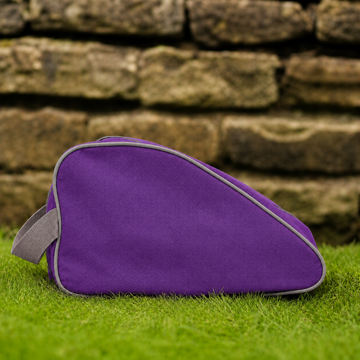 Purple waterproof boot bag with a curved zip opening and durable fabric finish.