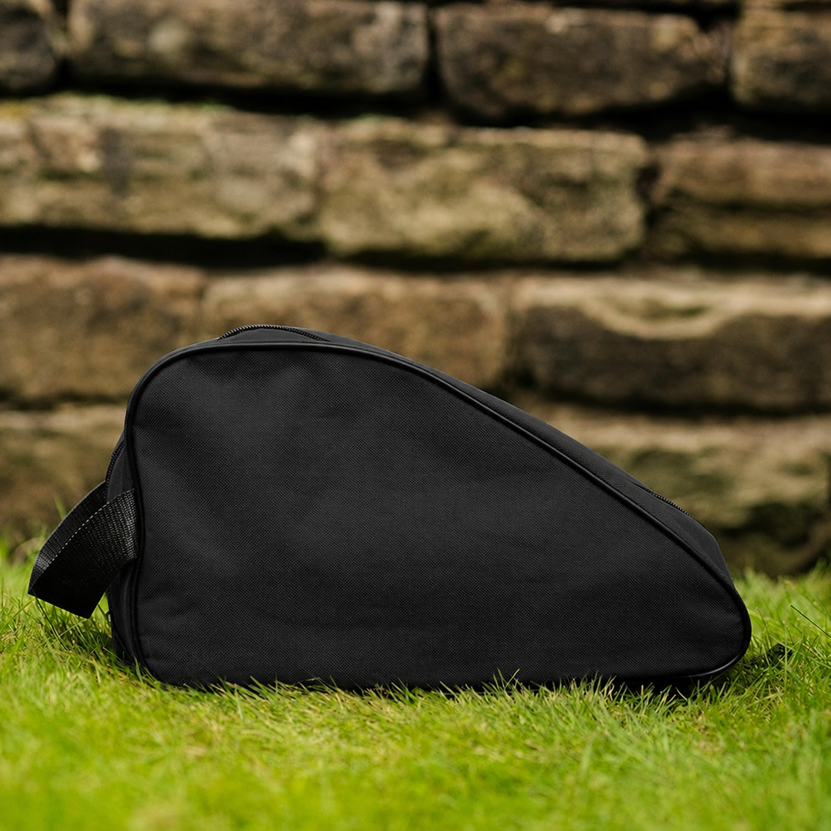 Black waterproof boot bag with a curved zip opening and durable fabric finish