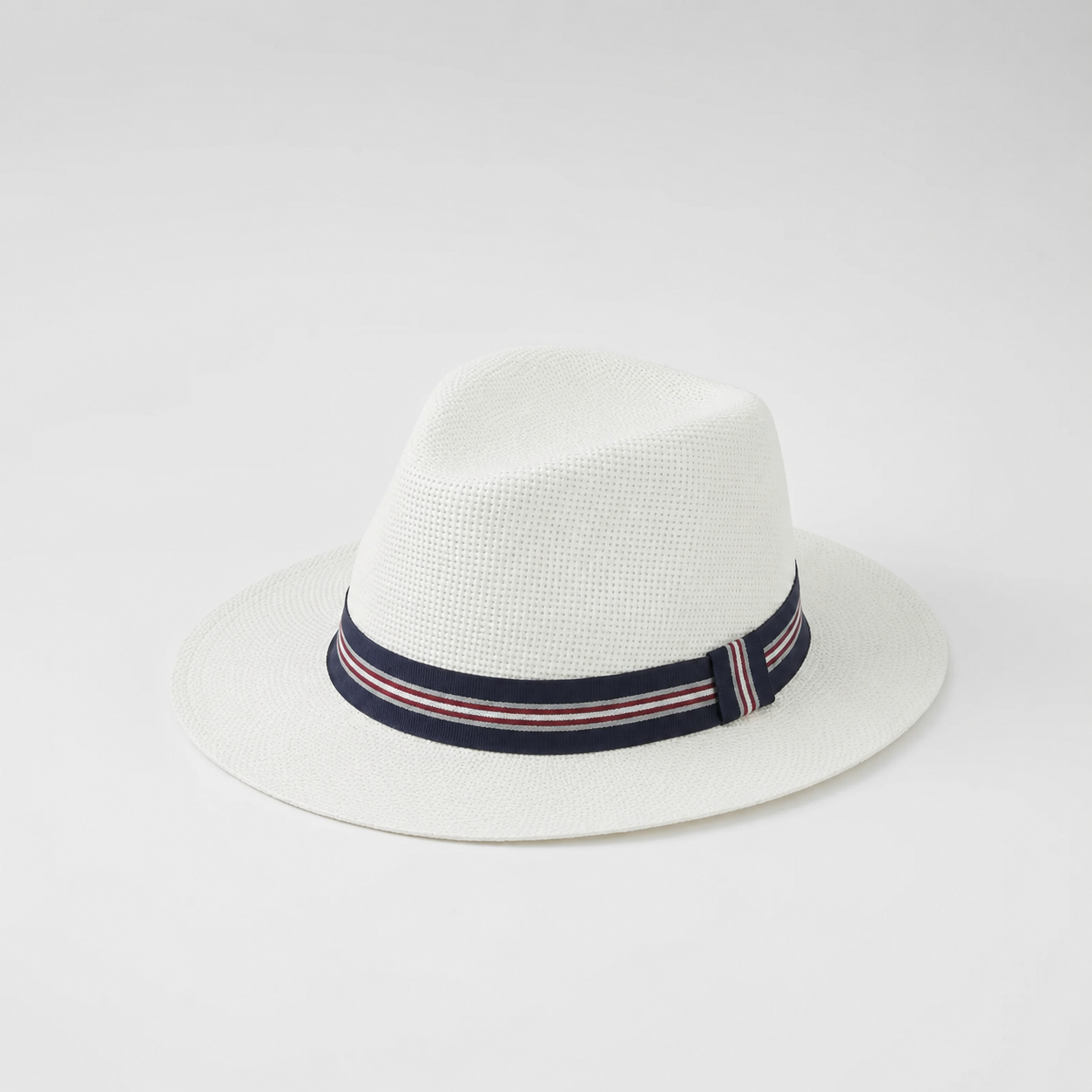 Cream Panama Hat with Navy Stripe Band – Cream woven Panama style sun hat with navy, red and white striped ribbon band"