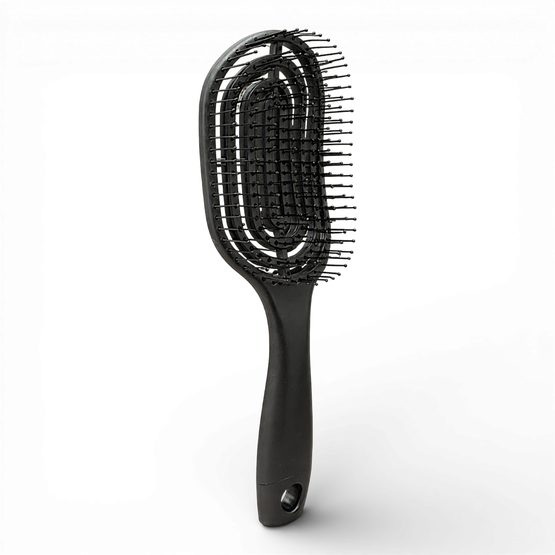 This black vented hair brush is designed for easy, gentle detangling and faster styling. Featuring flexible, ball-tipped bristles and a unique open design, it helps glide through knots with less pulling and reduced breakage.