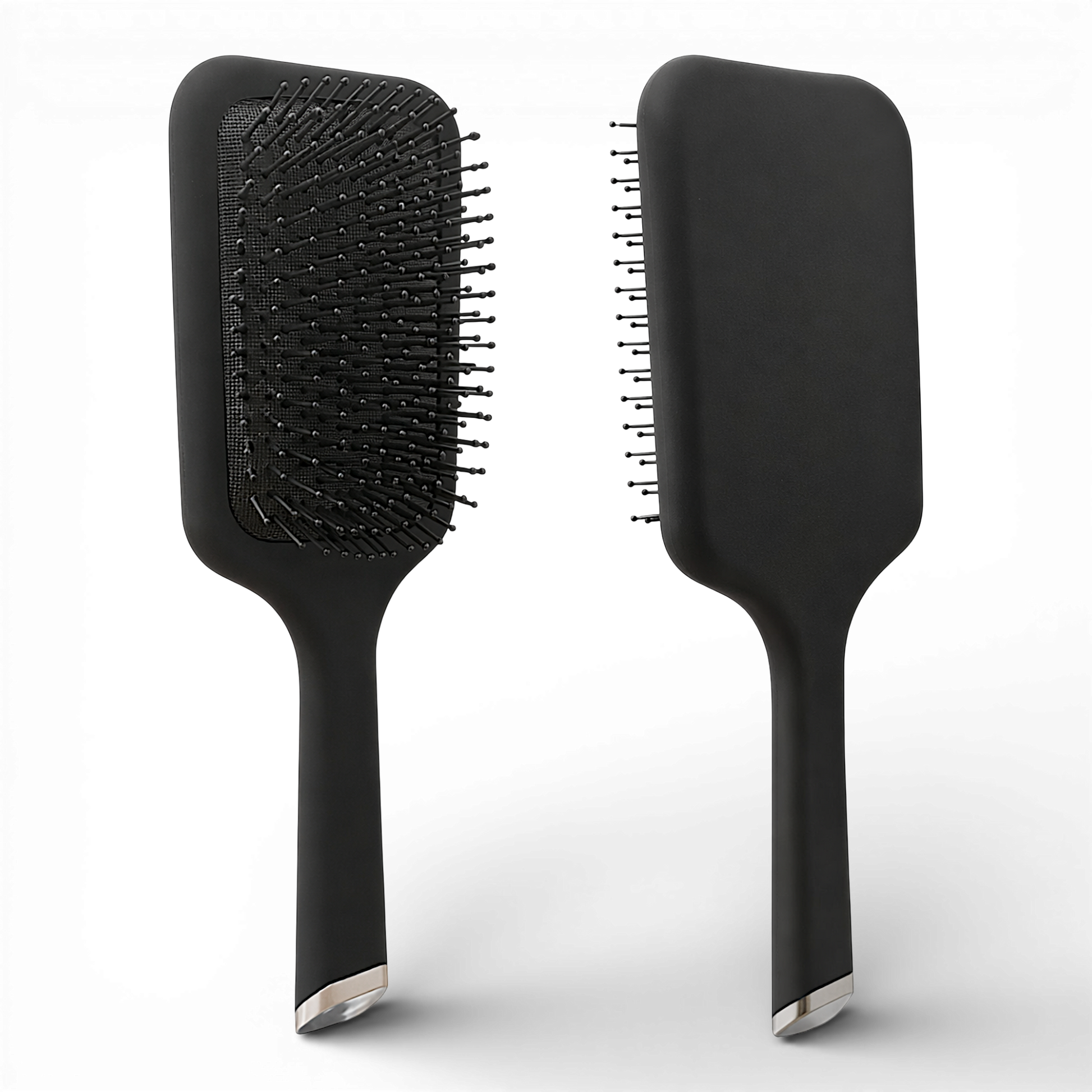 This sleek black paddle brush is designed for effortless detangling and everyday styling. Featuring flexible, ball-tipped bristles set on a cushioned base, it gently glides through hair to help reduce breakage, frizz, and scalp discomfort.