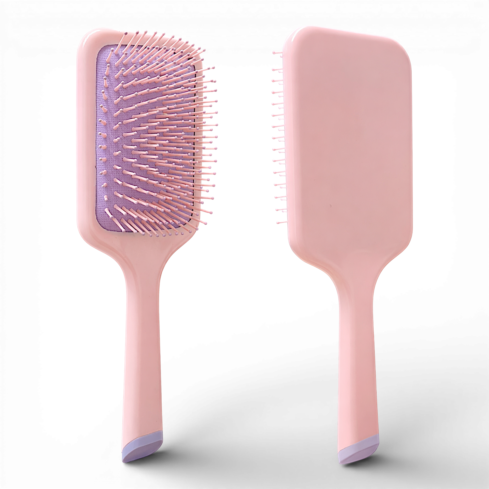 This sleek pink paddle brush is designed for effortless detangling and everyday styling. Featuring flexible, ball-tipped bristles set on a cushioned base, it gently glides through hair to help reduce breakage, frizz, and scalp discomfort.