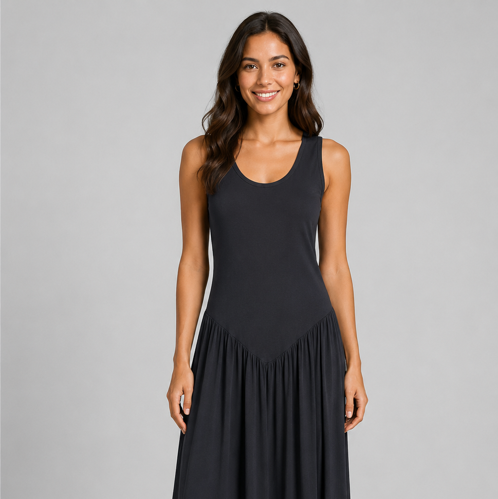 Women's sleeveless maxi dress featuring a scoop neckline, fitted bodice, and flowing gathered skirt. Shown in a soft brown jersey fabric with a relaxed silhouette and maxi length, styled on a model against a light grey studio background.