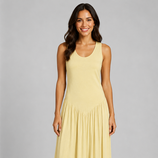 Women's sleeveless maxi dress featuring a scoop neckline, fitted bodice, and flowing gathered skirt. Shown in a soft brown jersey fabric with a relaxed silhouette and maxi length, styled on a model against a light grey studio background.