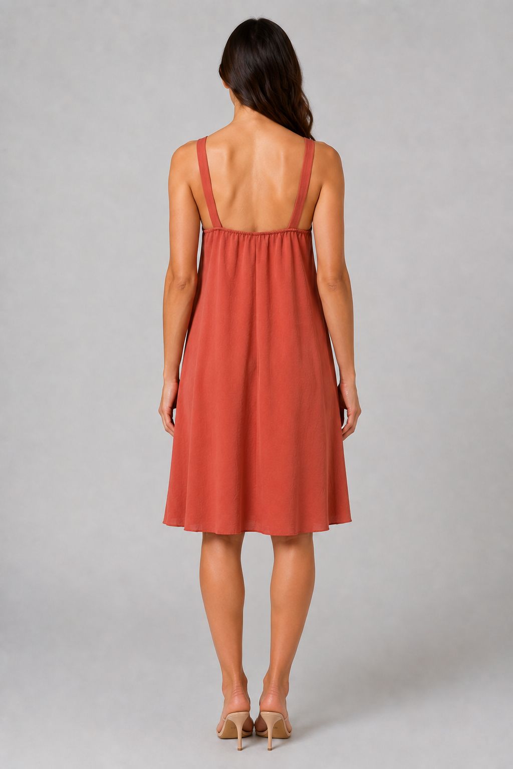 Terracotta sleeveless knee-length swing dress with a scoop neckline, subtle tonal texture and gold-tone chain-link shoulder details.