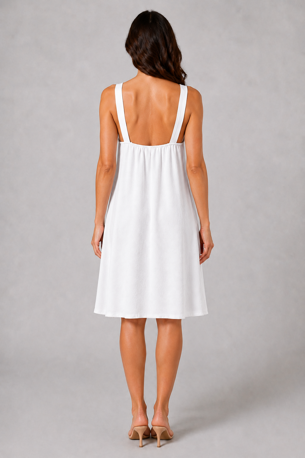 White sleeveless knee-length swing dress with a scoop neckline, subtle tonal texture and gold-tone chain-link shoulder details.