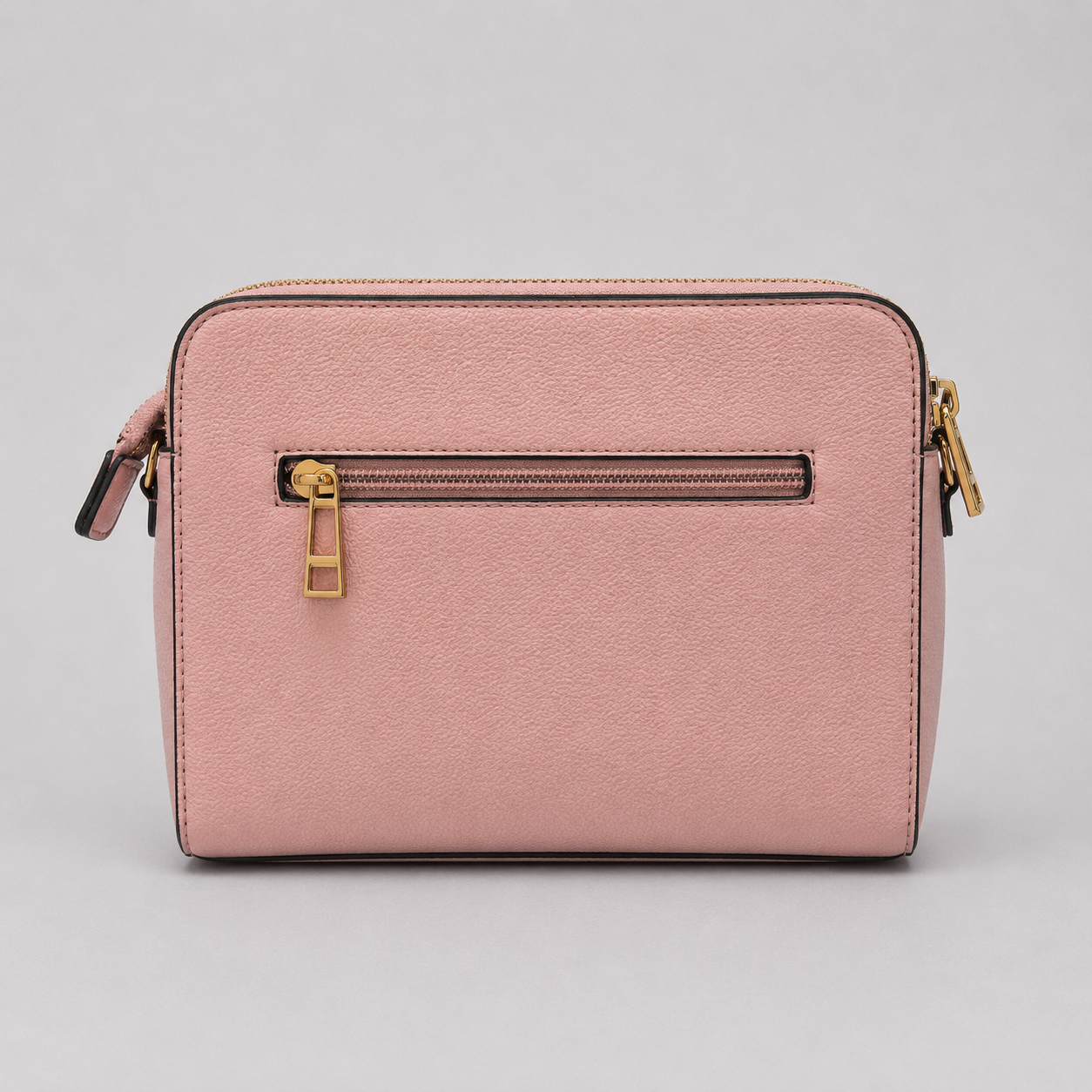 The Tote Bag crossbody bag with adjustable branded strap and gold hardware.