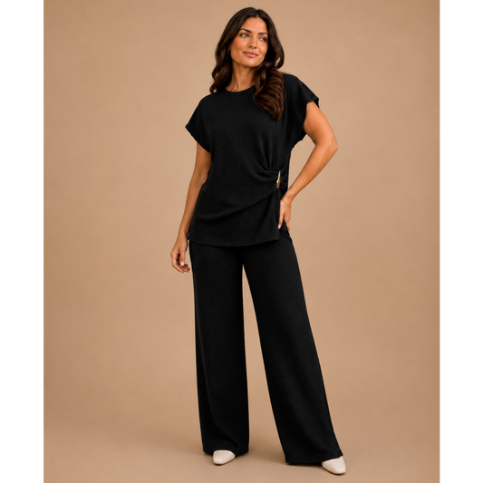 Women’s textured wide leg co-ord set with relaxed draped top and matching flowy trousers, elegant two piece lounge outfit for casual chic styling.