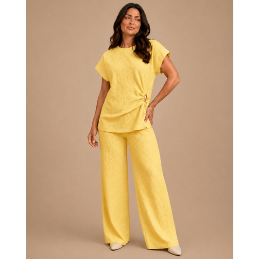 Women’s textured wide leg co-ord set with relaxed draped top and matching flowy trousers, elegant two piece lounge outfit for casual chic styling.