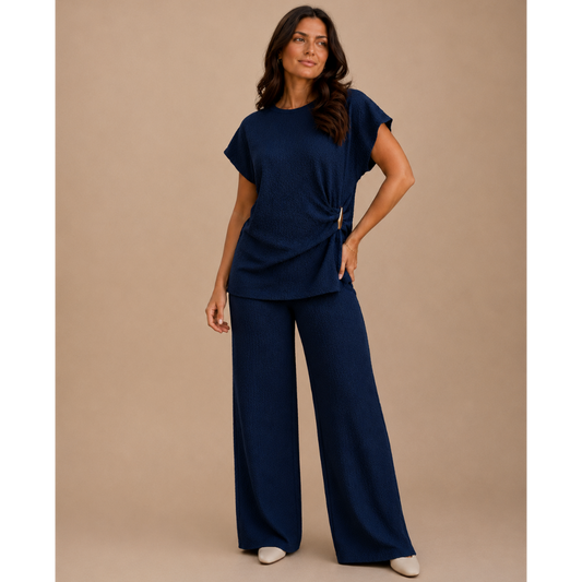 Women’s textured wide leg co-ord set with relaxed draped top and matching flowy trousers, elegant two piece lounge outfit for casual chic styling.