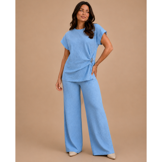 Women’s textured wide leg co-ord set with relaxed draped top and matching flowy trousers, elegant two piece lounge outfit for casual chic styling.