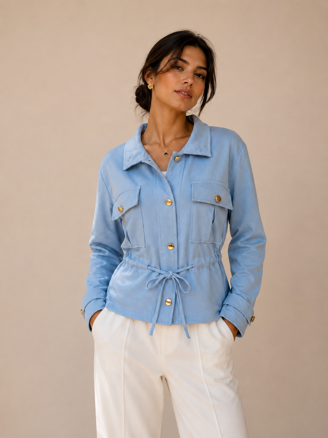 Elegant women’s lightweight drawstring jacket with utility pockets, gold button detail and funnel neck for versatile styling