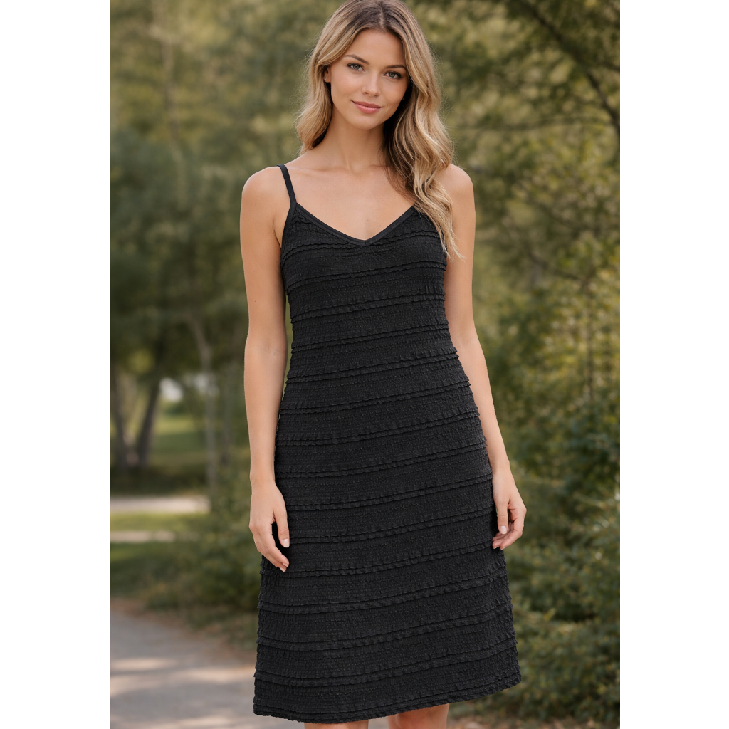 Upgrade your warm-weather wardrobe with this textured tiered cami dress, a must-have ruffle summer dress designed for effortless style and comfort. Featuring delicate spaghetti straps, a flattering V-neckline, and soft horizontal ruffle tiers, this dress creates a feminine silhouette with beautiful movement.

Made from a lightweight, breathable fabric, this tiered midi dress is perfect for everyday wear, vacations, brunch, or summer events. The relaxed fit makes it easy to wear, while the textured detailing