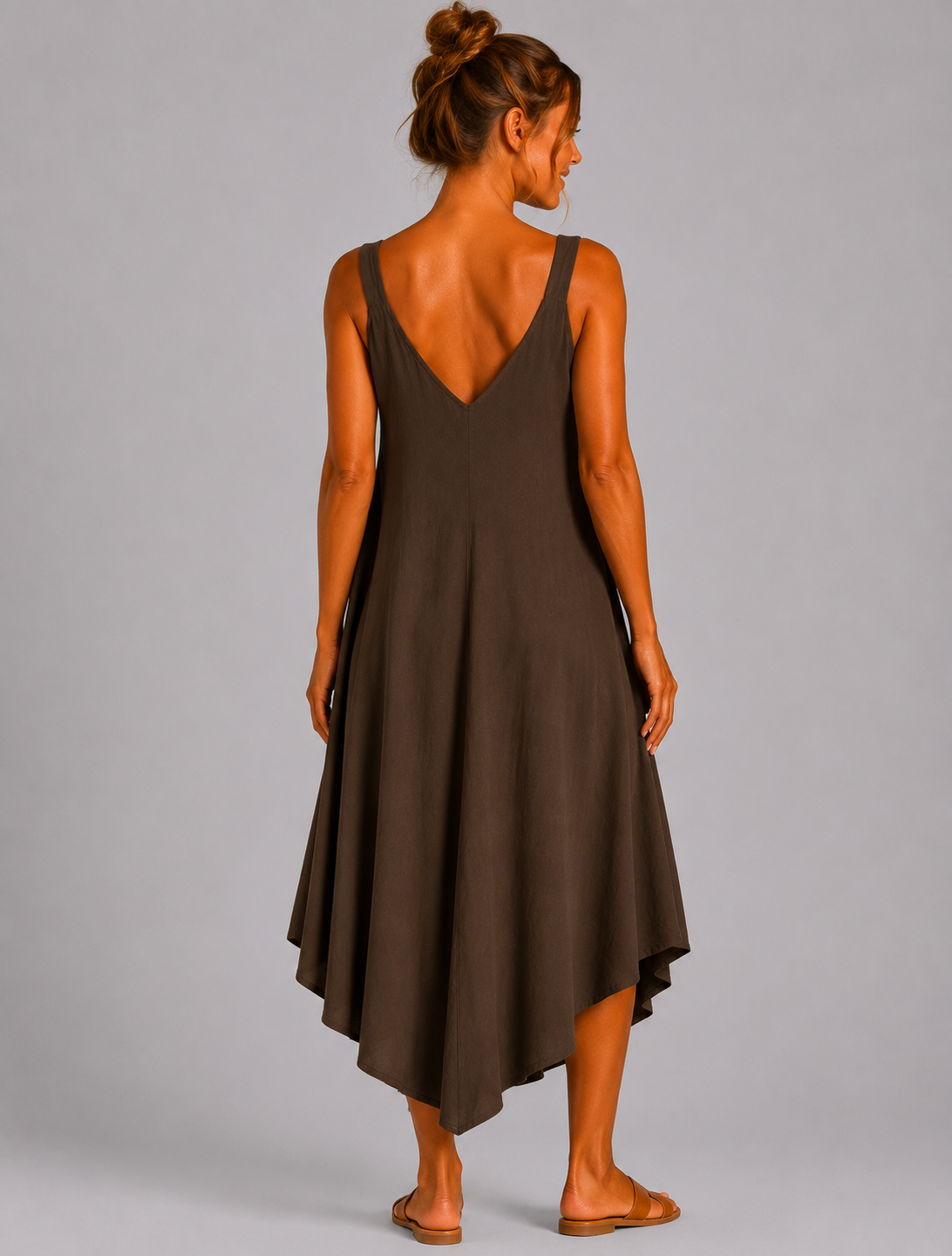 Women’s sleeveless textured swing midi dress with a V-neckline and relaxed flowing fit