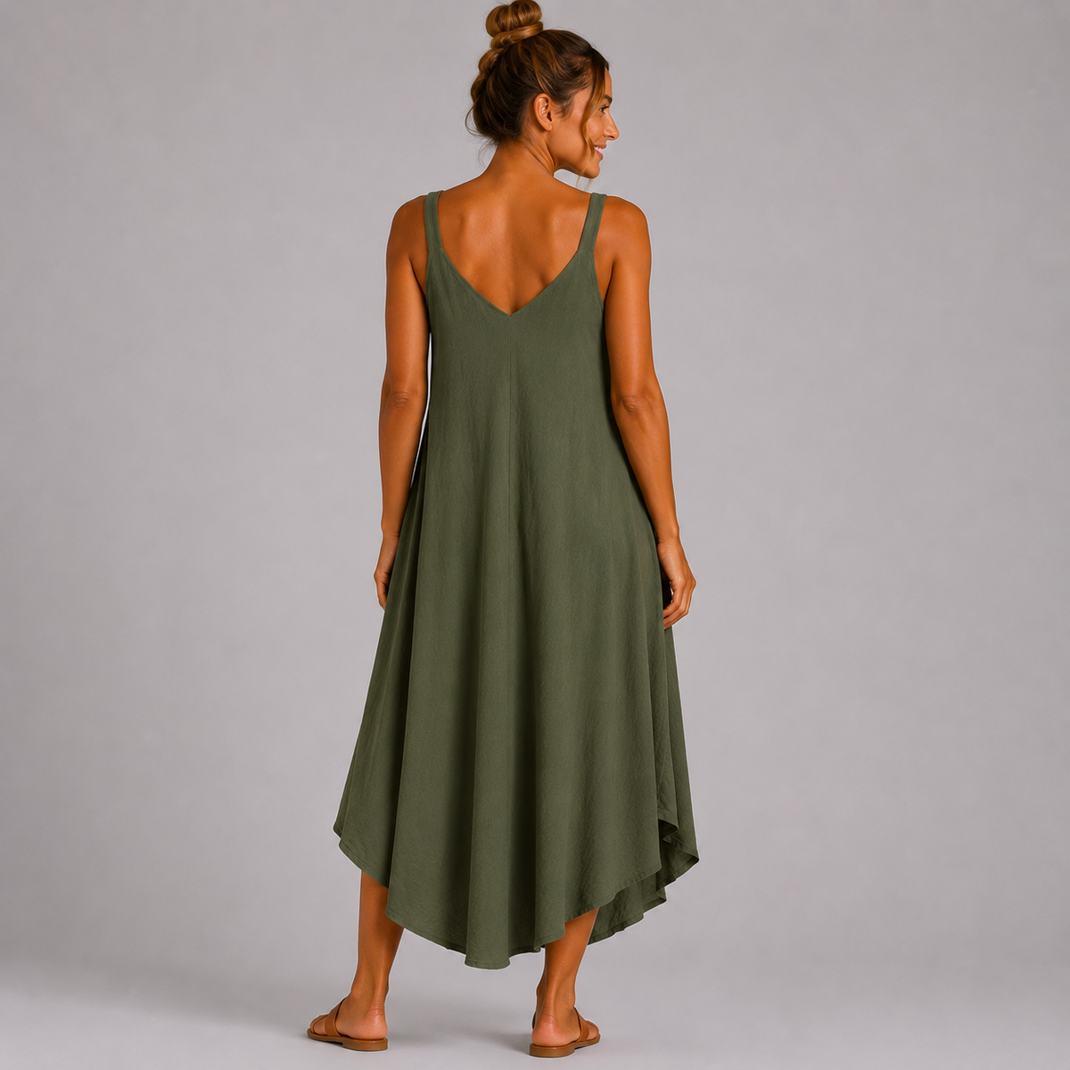 Women’s sleeveless textured swing midi dress with a V-neckline and relaxed flowing fit