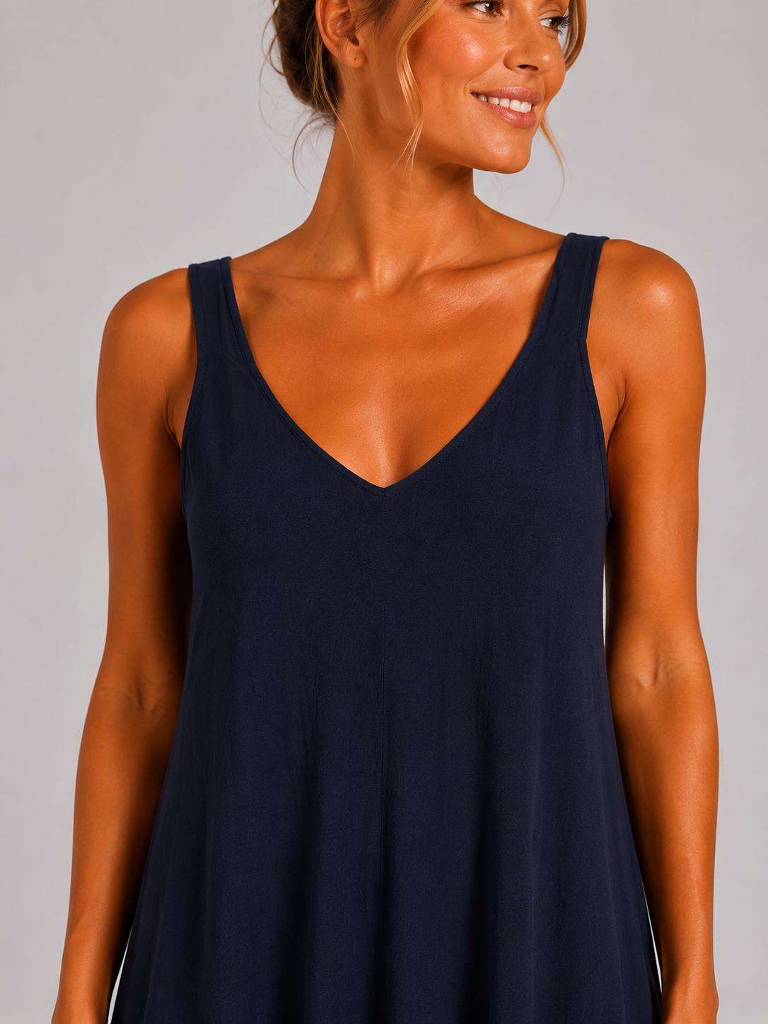 Navy Women’s sleeveless textured swing midi dress with a V-neckline and relaxed flowing fit