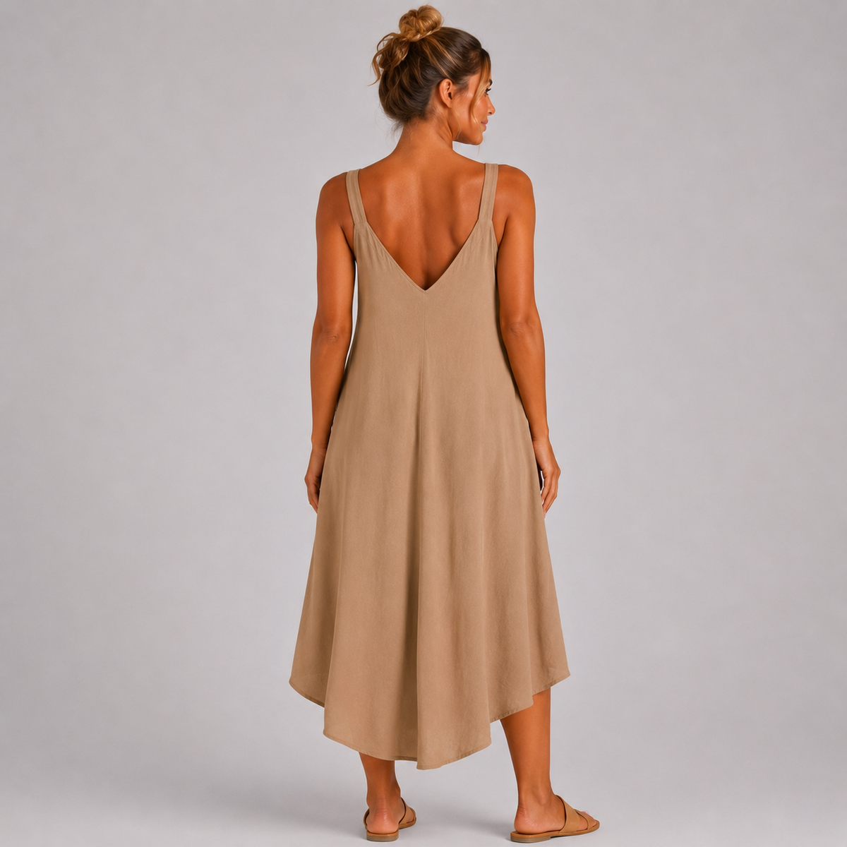 Women’s sleeveless textured swing midi dress with a V-neckline and relaxed flowing fit
