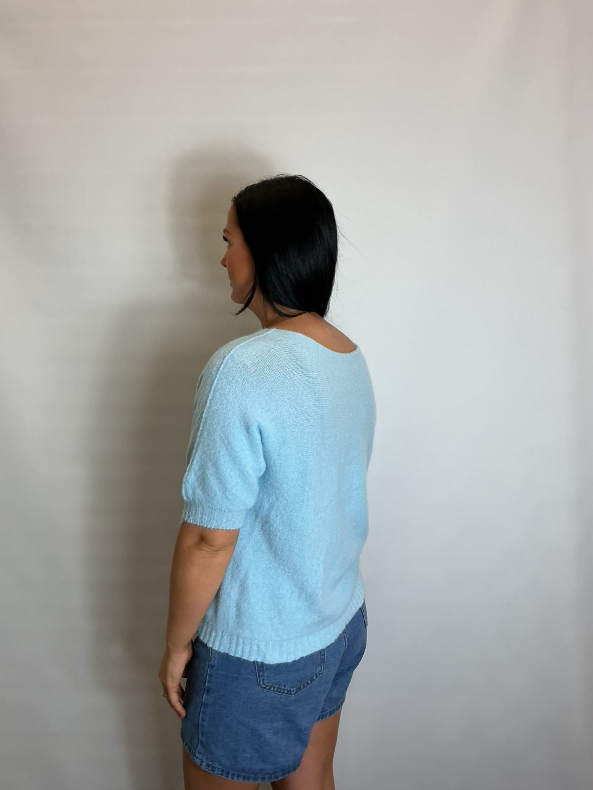 Women’s Light Blue short-sleeve relaxed knit jumper with a wide round neckline and ribbed cuffs and hem.