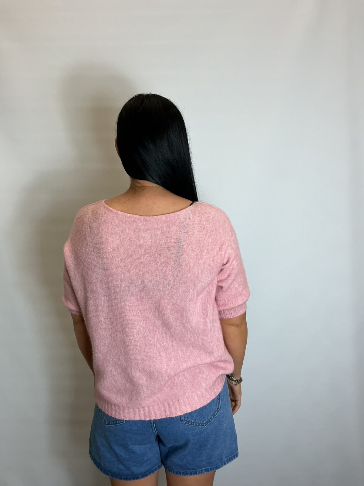 Women’s Light Pink short-sleeve relaxed knit jumper with a wide round neckline and ribbed cuffs and hem.