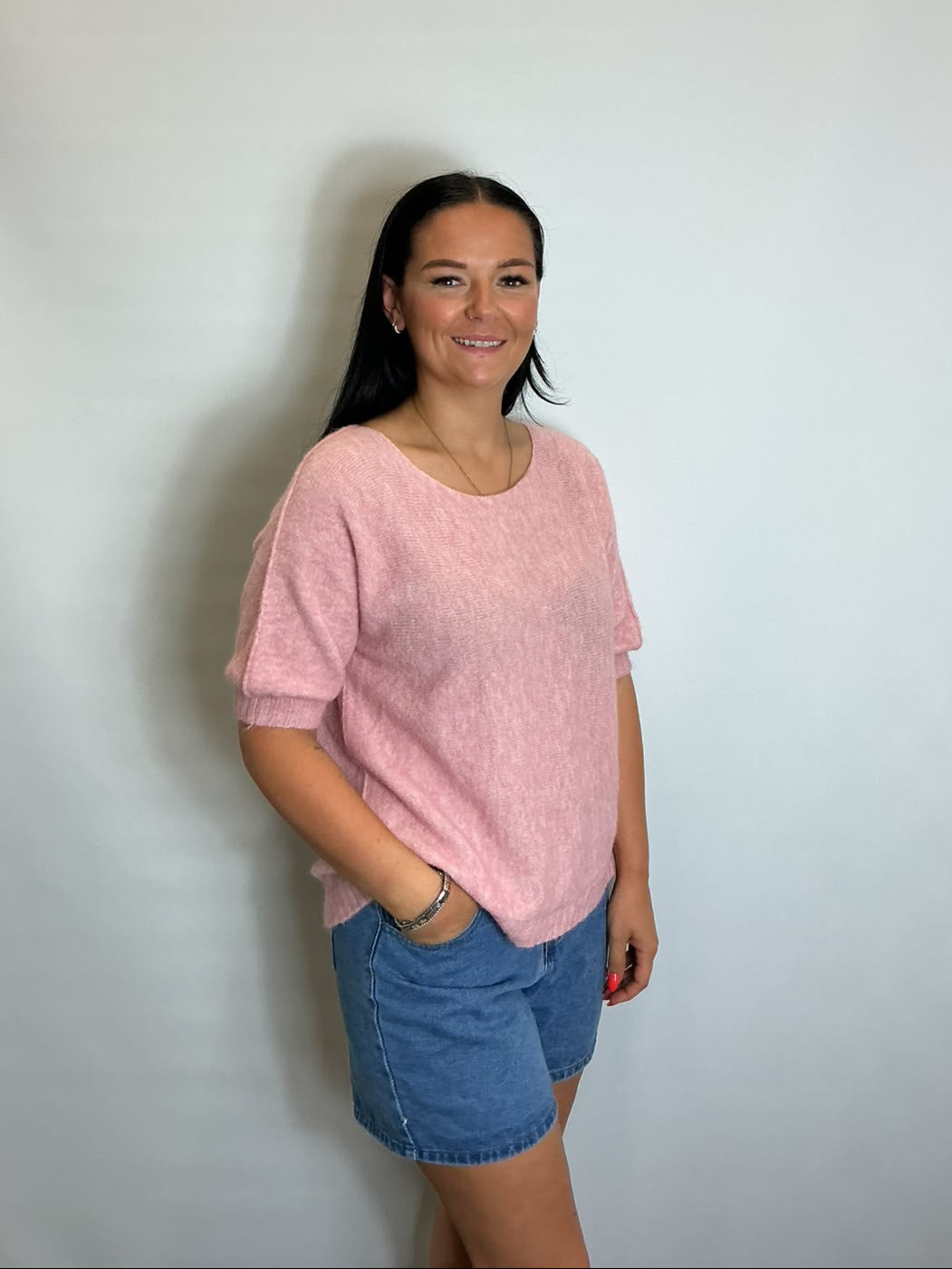 Women’s Light Pink short-sleeve relaxed knit jumper with a wide round neckline and ribbed cuffs and hem.