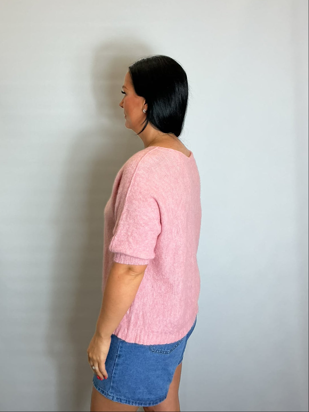 Women’s Light Pink short-sleeve relaxed knit jumper with a wide round neckline and ribbed cuffs and hem.
