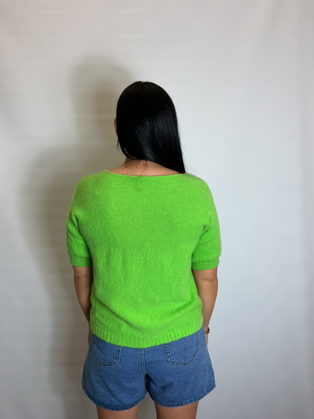 Women’s Lime Green short-sleeve relaxed knit jumper with a wide round neckline and ribbed cuffs and hem.