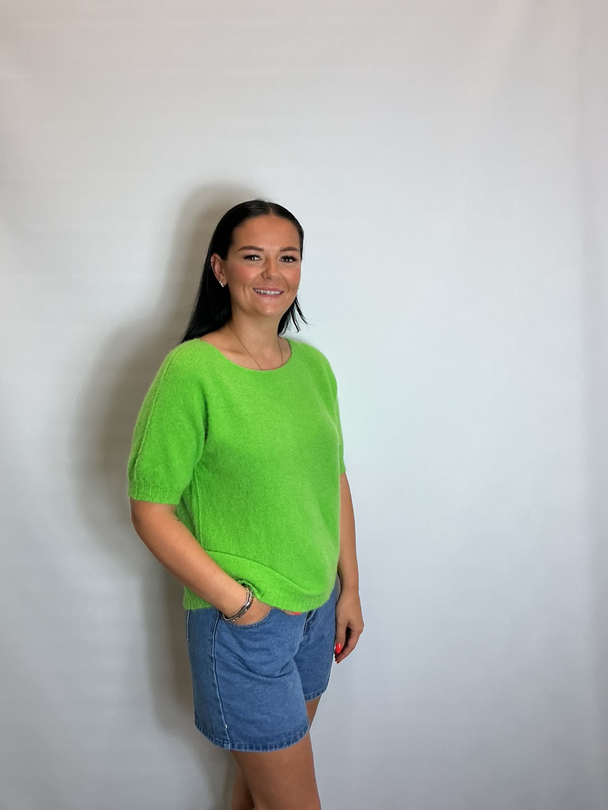 Women’s Lime Green short-sleeve relaxed knit jumper with a wide round neckline and ribbed cuffs and hem.