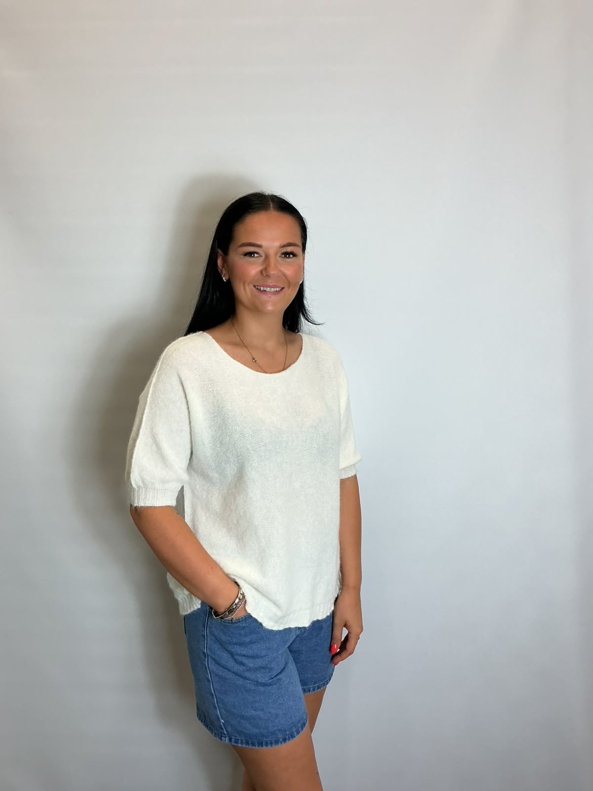 Women’s White short-sleeve relaxed knit jumper with a wide round neckline and ribbed cuffs and hem.