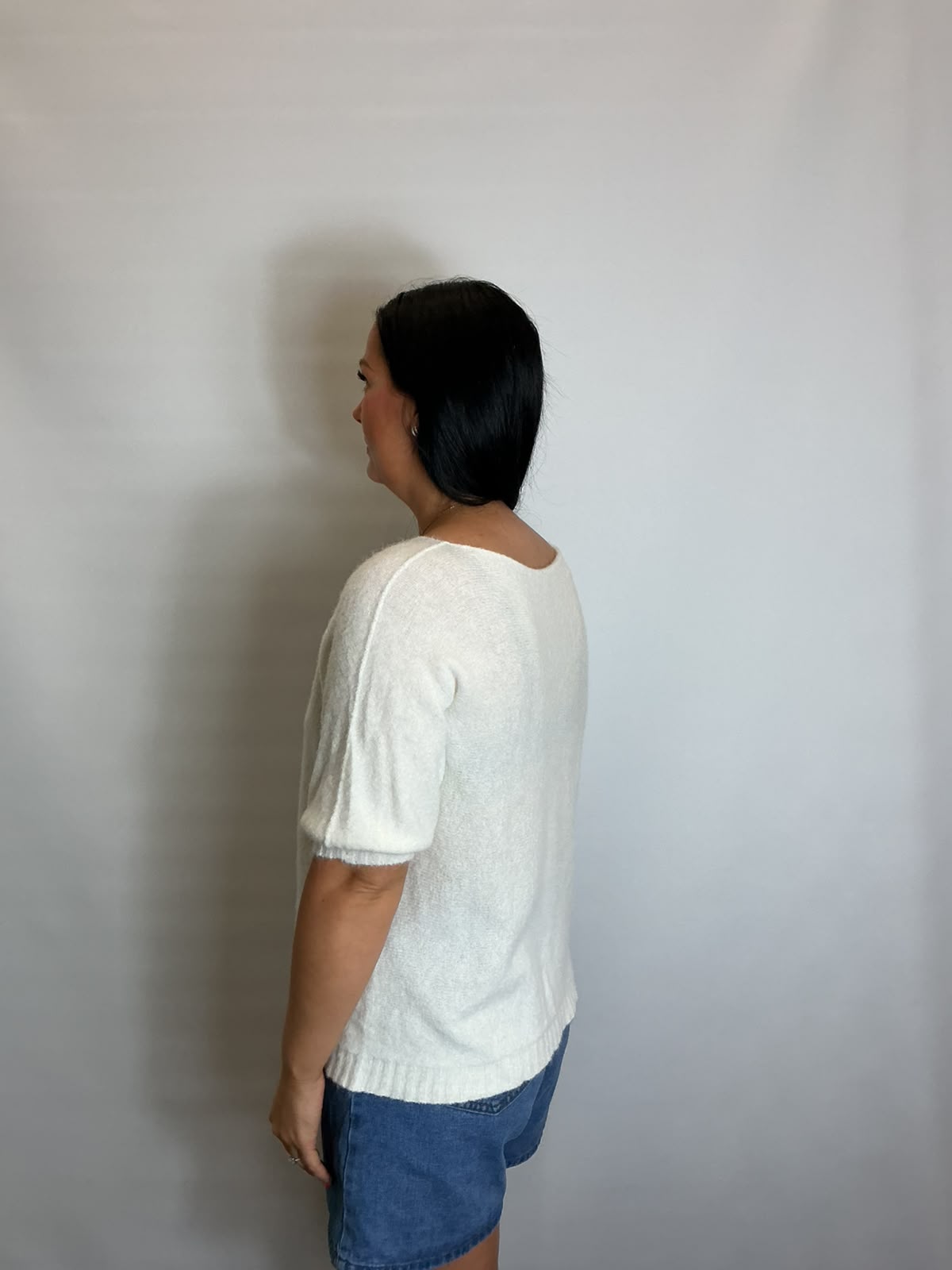 Women’s White short-sleeve relaxed knit jumper with a wide round neckline and ribbed cuffs and hem.