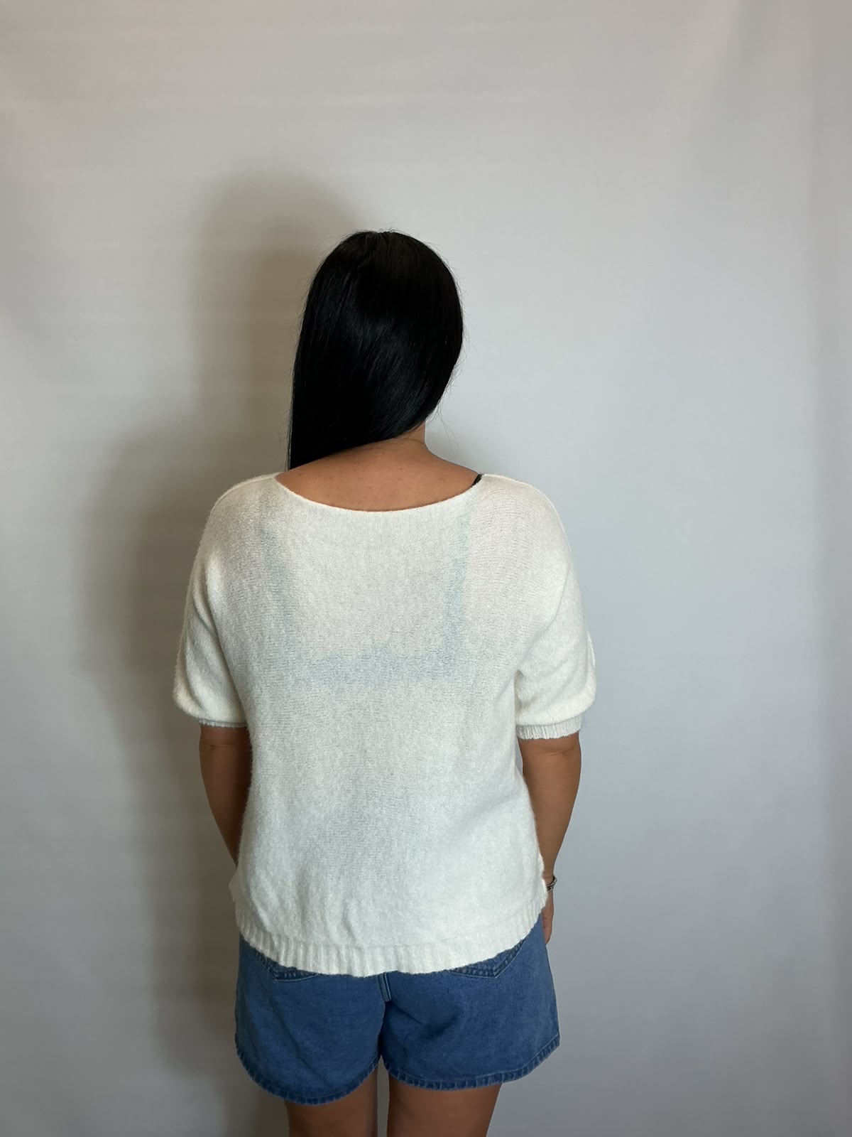Women’s White short-sleeve relaxed knit jumper with a wide round neckline and ribbed cuffs and hem.