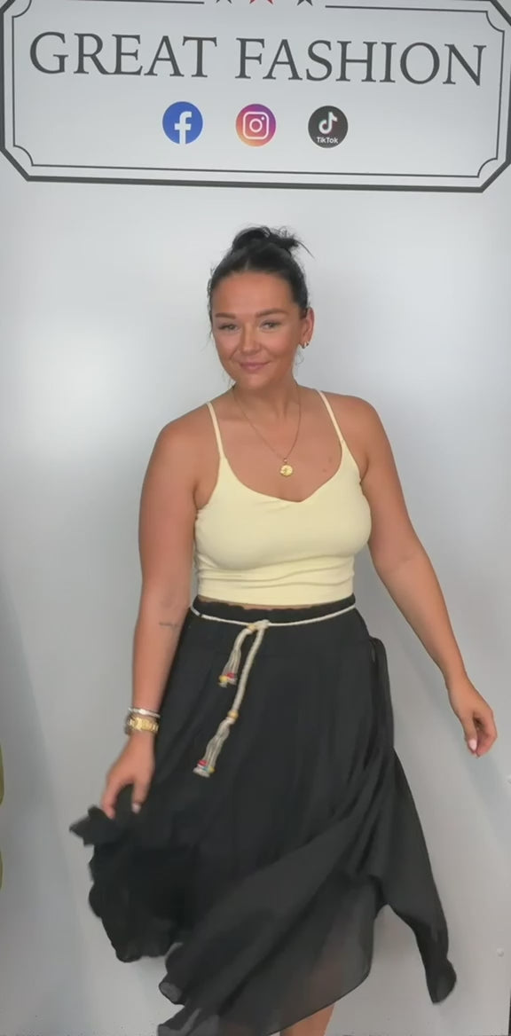 Ladies Italian boho maxi skirt in Black with an asymmetric hem, elasticated drawstring waistband and flowing relaxed fit.